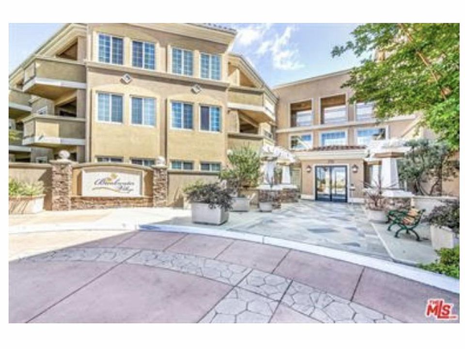 The 1st photo is the Front Entrance to the Condominium. The second photo is the Courtyard and Swimming Pool.