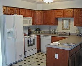 Kitchen Area: upgrades include ceramic floor, cherry cabinets, and granite