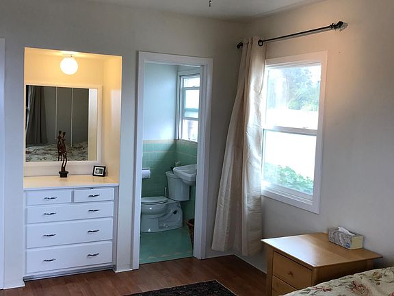 Bedroom with Queen bed, fan and walk in closet