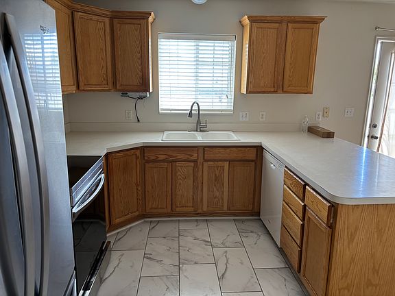 Kitchen with included appliances