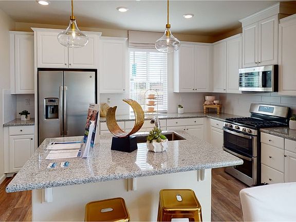 This multifunctional and spacious kitchen comes fully equipped with a large center island, brand-new