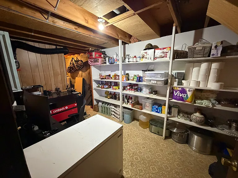 Large storage space in basement floor with cellar
