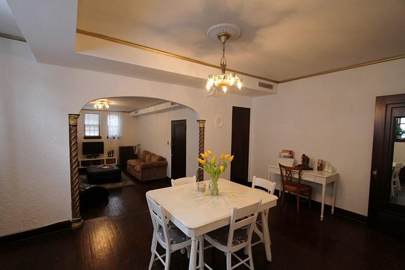 Dining room with arched opening at 3028 James Ave S