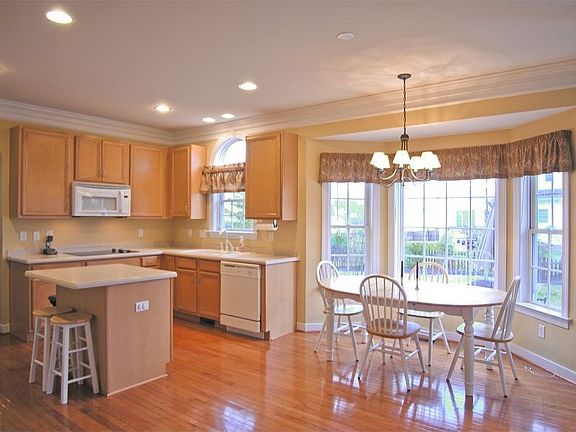 Open Kitchen with Hardwoods, Corion, Center Island & Breakfast Area