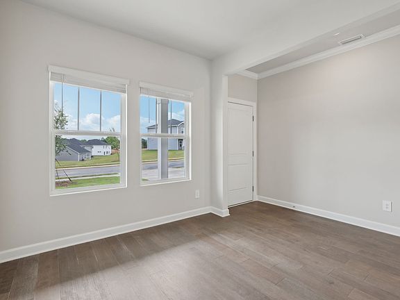The flex room is perfect for a dining area or home office space.