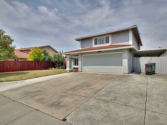 Convenient side yard access and carport cover
