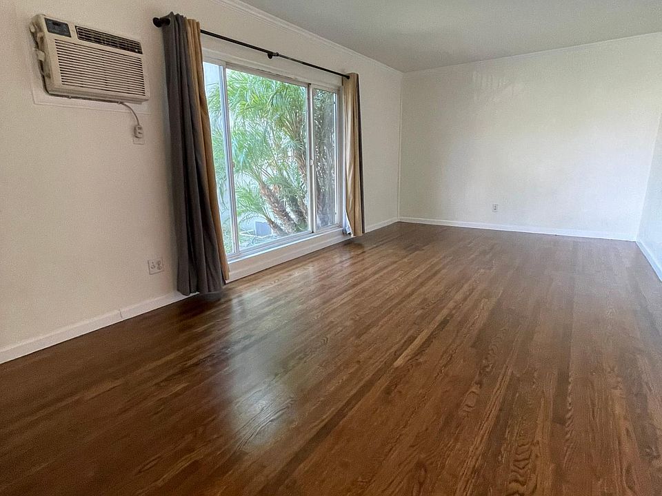 Living room from front door with hardwood floors throughout beautiful and picture window