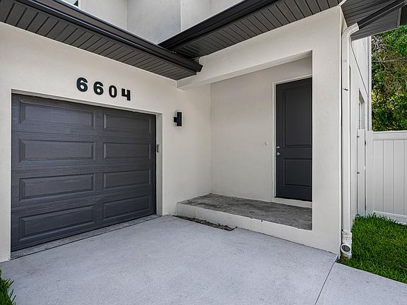 single car garage with room for 2 more vehicles in driveway