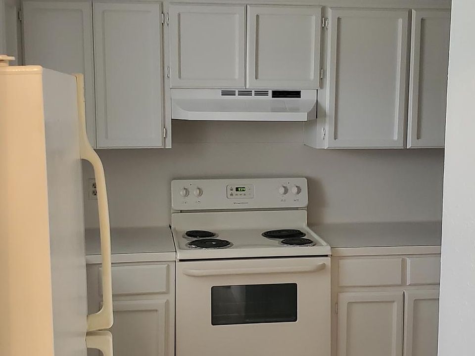Kitchen shelves . Ceramic Tile floor.