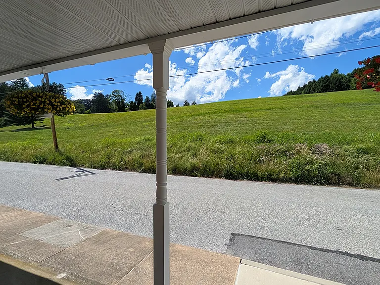 From your front porch you view a 10-acre field in farmland preservation that changes with the seasons. Manager takes care of snow removal.