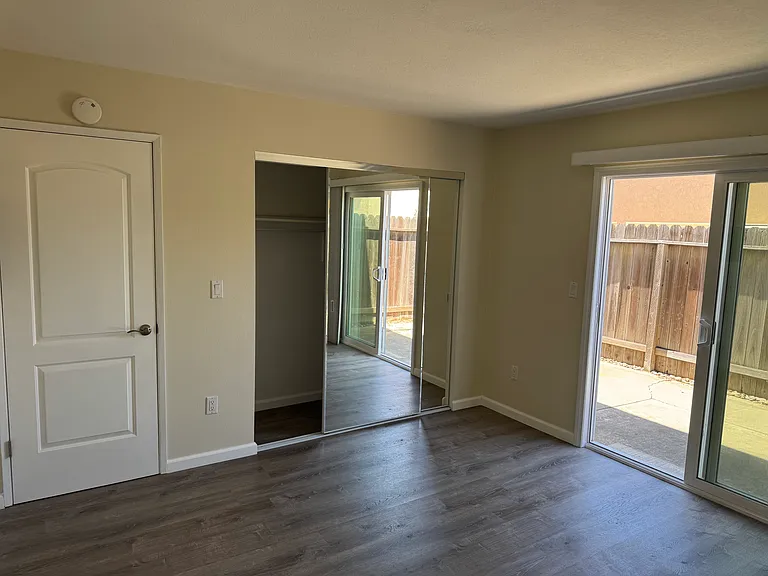 Bedroom leads to the back patio.