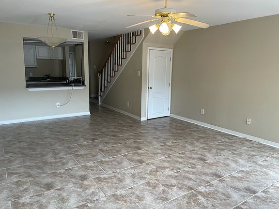 Living area / dining area. Storage area under stairs.