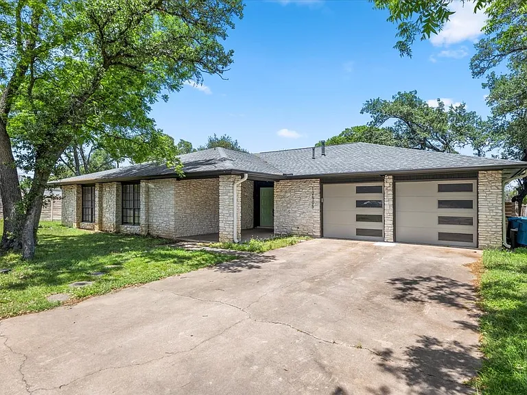 Two car garage, large shaded front porch on cul-de-sac