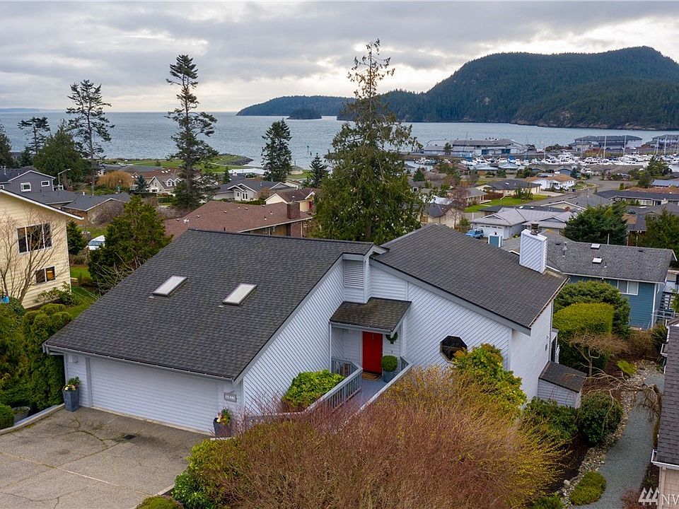 Welcome to 5011 Macbeth Dr in Skyline, Anacortes. This gorgeous view home features, Burrows Bay, Island, Olympic Mtn and Marina views! Home features dazzling new remodeled view kitchen, new hickory floors on the main. 2996 sq ft of living space with downstairs family room with wet bar, warm and inviting sun room and 3 bedrooms. Gorgeous mature lush grounds. 