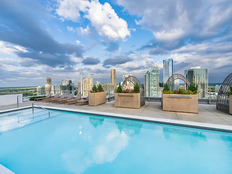 Take in sweeping Atlanta skyline views from the rooftop pool at Modera Old Ivy, where elevated design and open-air lounging define the day.