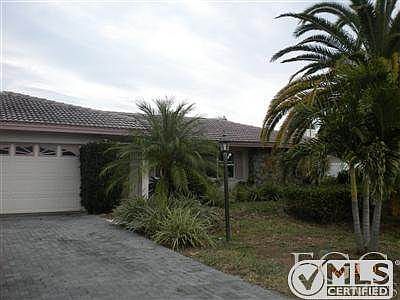 Paver driveway and professional landscaping gives nice curb