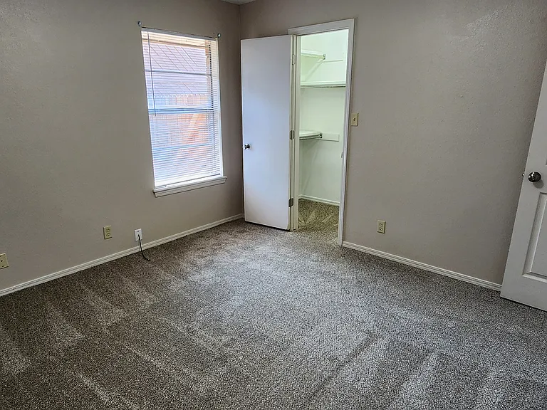 SECOND BEDROOM ALSO HAS A WALK-IN CLOSET. MAIN BATH JUST ACCROSS THE HALL.