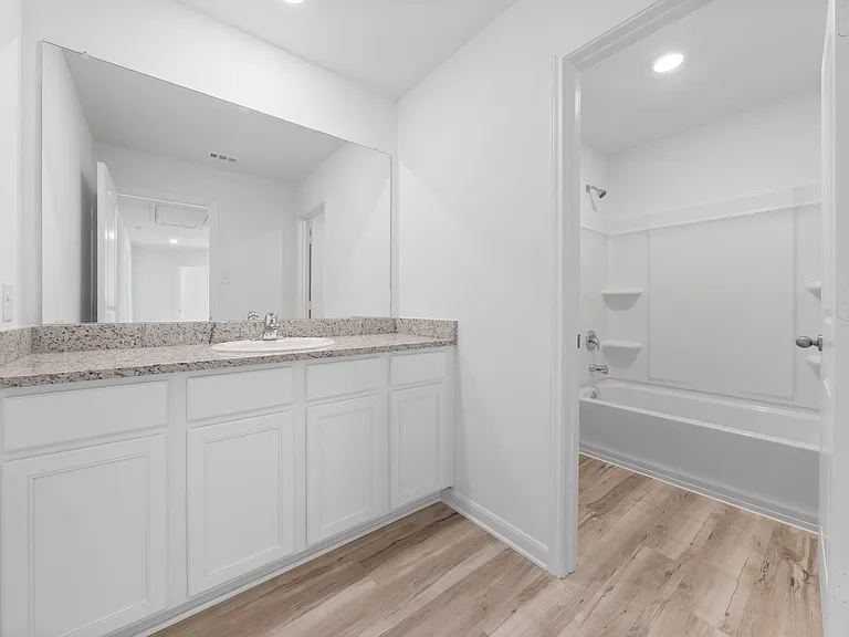 Additional bathroom located upstairs.