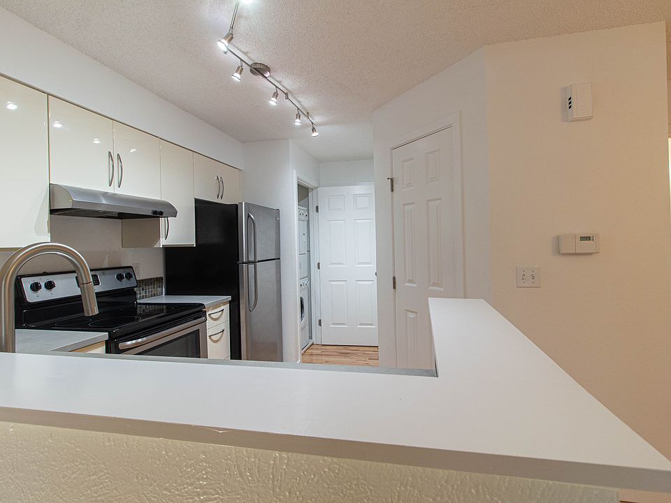 Kitchen, looking toward garage entry.