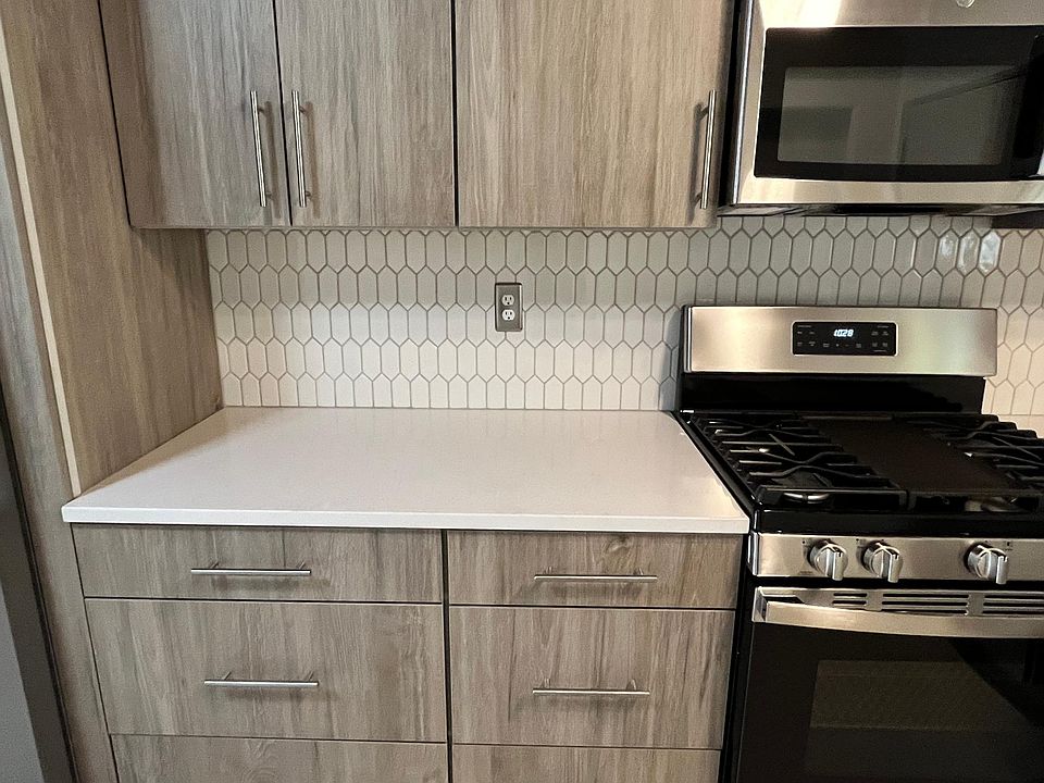 New Stainless Steal Gas Cooktop and Microwave. Lots of cabinet space.