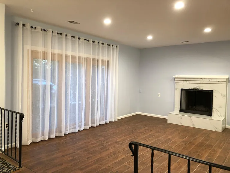 LR with recessed lights and fire place