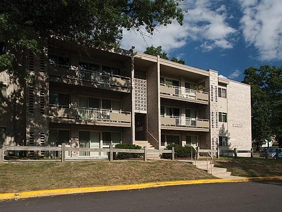Sliding glass doors open to giant covered balcony or patio