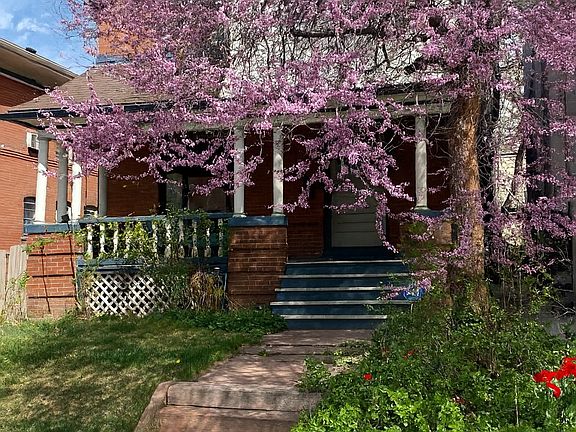 The front tree changes in fall to a striking purple with the change of the season.