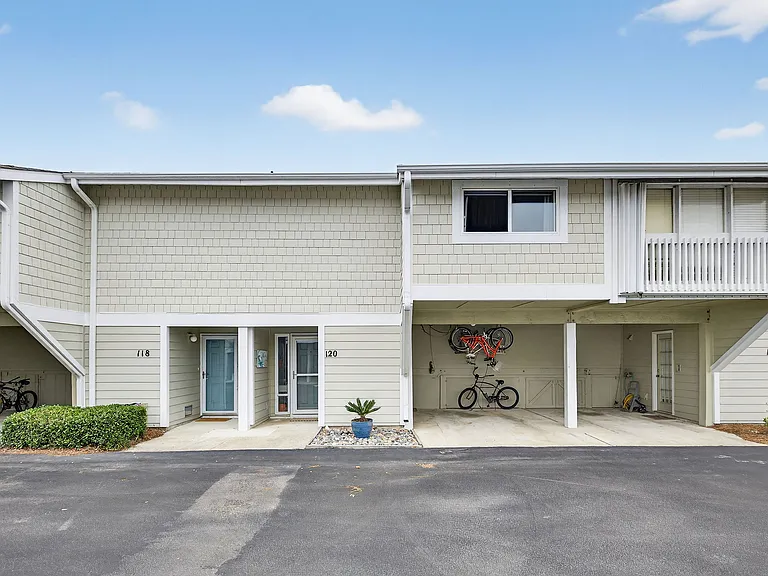Carport for covered parking with storage closet