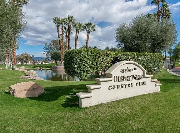 Welcome sign at entrance on Country Club Dr.