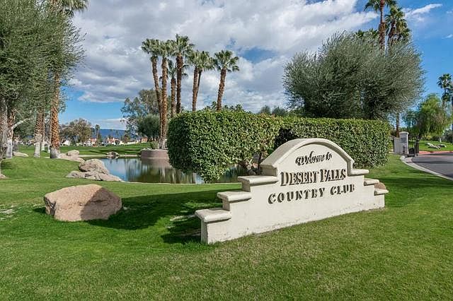 Welcome sign at entrance on Country Club Dr.