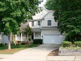 Welcome to the Park-Like Setting of this Transitional Home on .317 Acres