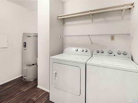 This laudry room is very spacious and could be used for addi