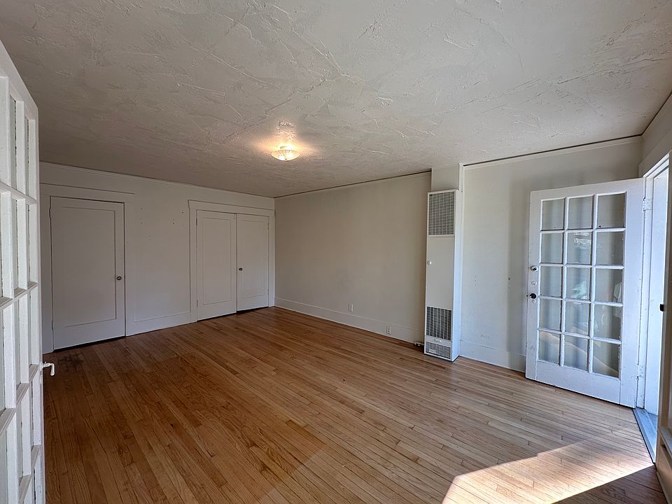 view of living space and front door from kitchen doors