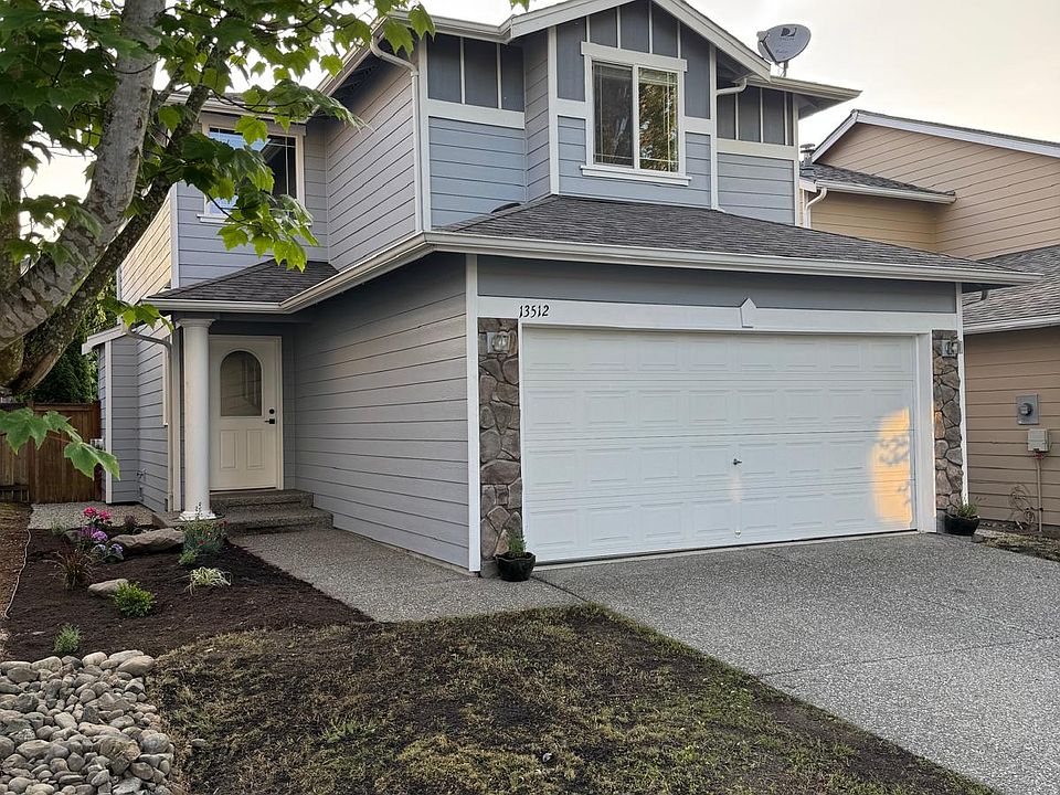 Front door with fresh landscaping