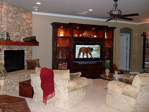 Open family room w/ corner fireplace.