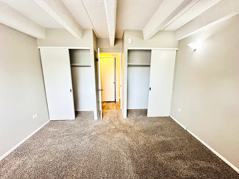 Embrace comfort in this inviting bedroom featuring generous closet space and soft carpet flooring. Embrace comfort in this inviting bedroom featuring generous closet space and soft carpet flooring.