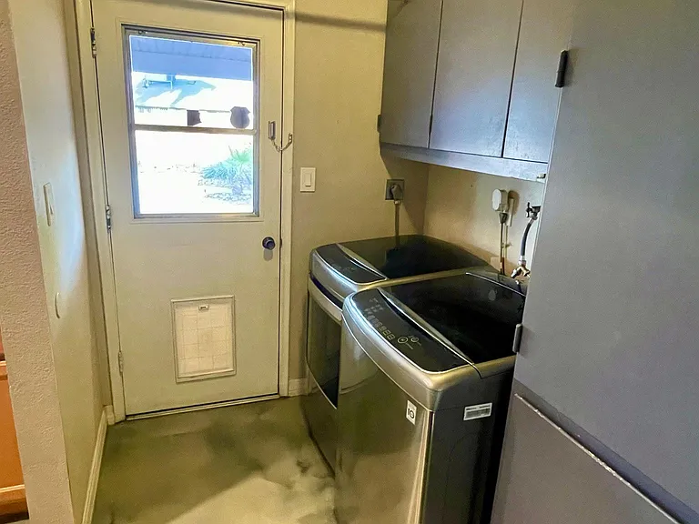built-in dog door and utility door pass-through to the backyard