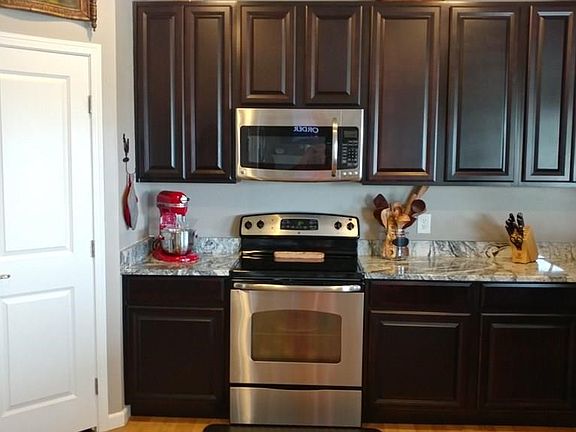 BEAUTIFUL KITCHEN WITH TALL CABINETS AND HUGE PANTRY.
