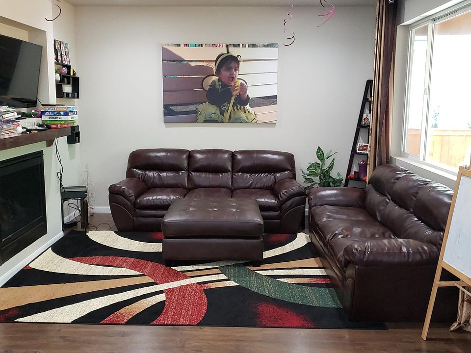 Living room with gas fired fireplace.
