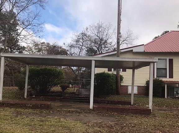 Carport in close proximity to rear entrance