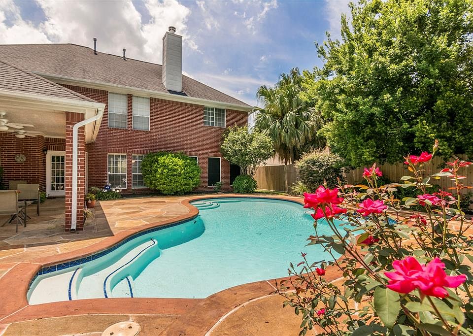 Enjoy the backyard pool and breezy covered patio!