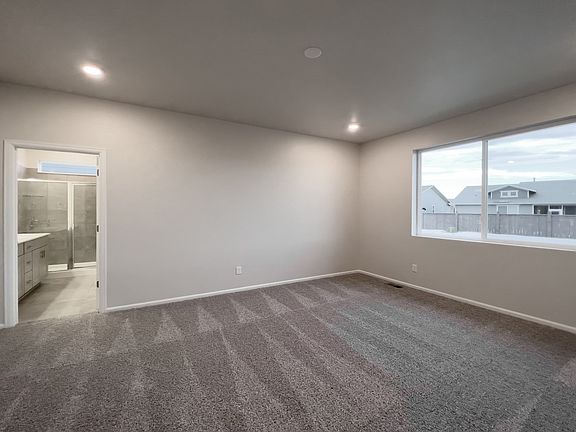 A primary bedroom perfect for unwinding after a long day.