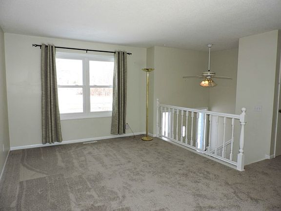 Living room with brand new carpet.