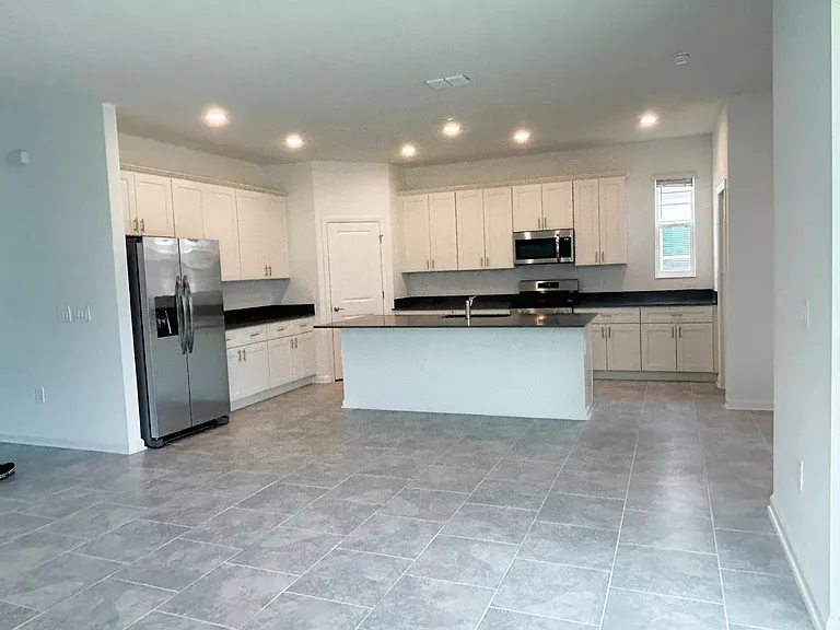 Open-concept living with a seamless flow between the kitchen, dining, and living areas.