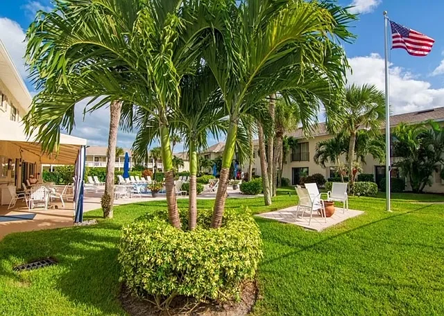 Park-like setting surrounding community pool.