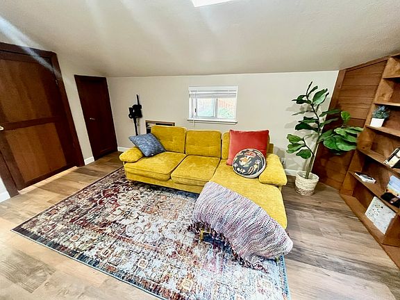 A soft couch with chaise is perfect for R&R. With the windows open you can sometimes hear the creek during the winter season or the wind blowing through surrounding redwoods