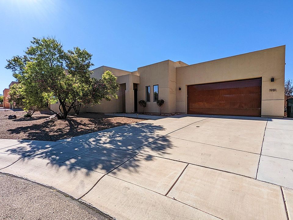 Front exterior with widened driveway