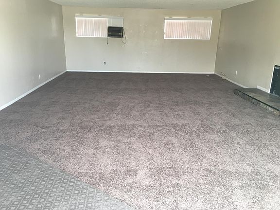 Extra space living room with fireplace 