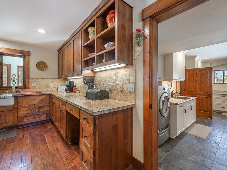 There's space for a kitchen workstation and the adjacent laundry room off the garage is super convenient