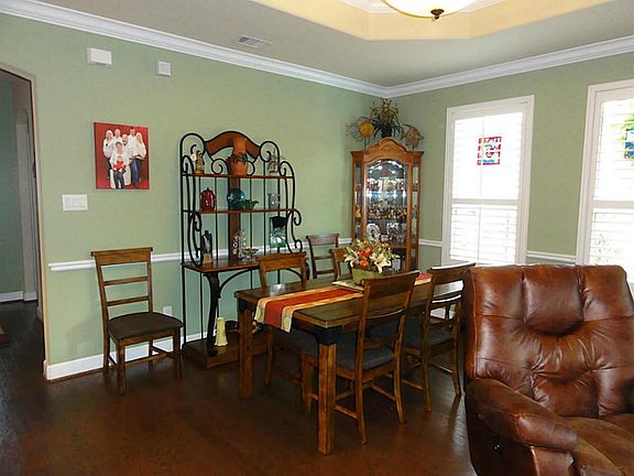The dining area; wood floors and plantation shutters through-out.